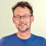 Portret van René Vlak, Digital Communications Adviser bij SOMO.